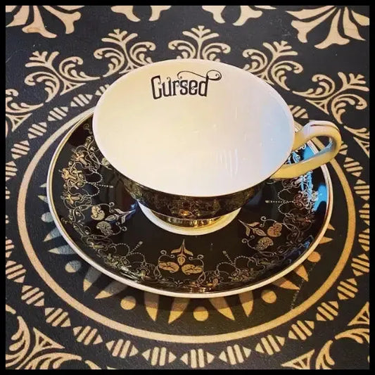 Black Nouveau Cursed Cup and Saucer by Miss Havishham Curiosities