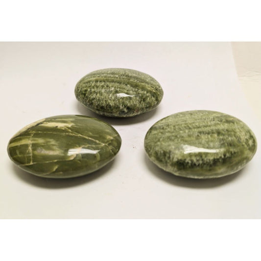 Tremolite palm stone for calmness and balancing Chaotic Energy